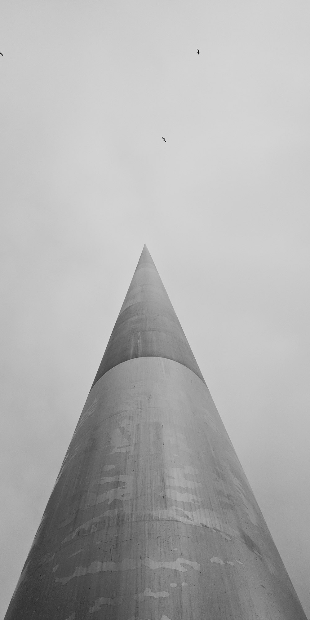 low-angle grayscale photo of high-rise building