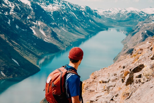 man on mountain edge in Besseggen Norway