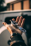 person holding Mercedes-Benz fob