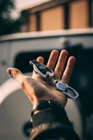 A technician cutting a new car key inside a locksmith van.
