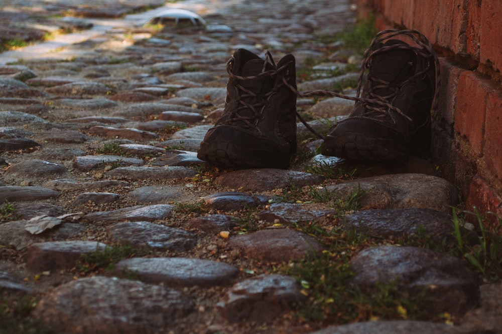 pair of black boots on floor