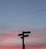 silhouette of a road signage during golden hour