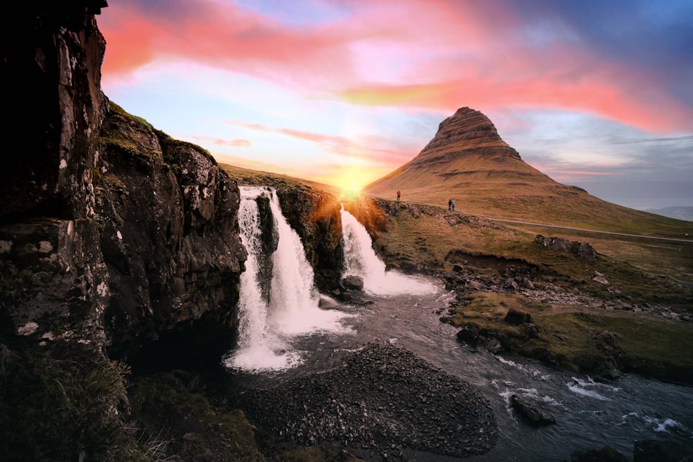 waterfalls between rock formation at golden hour