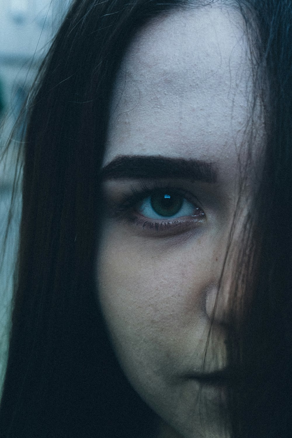 closeup photo of half face of woman