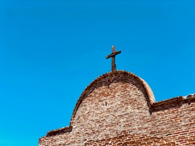 brown cross on chapel