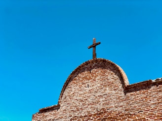 brown cross on chapel