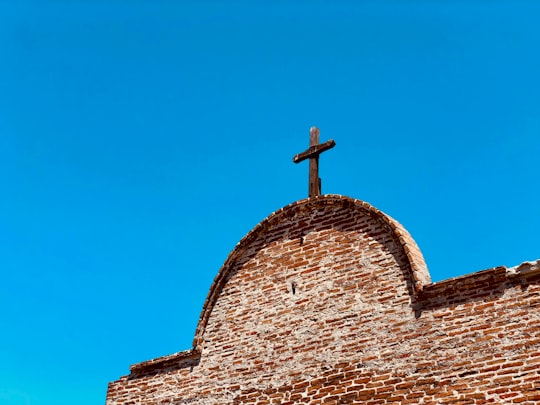 brown cross on chapel in Mission San Juan Capistrano United States
