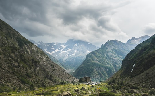 white shed surrounded by mountains in Écrins National Park France