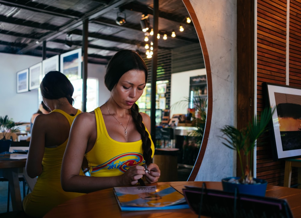 woman standing in front of table