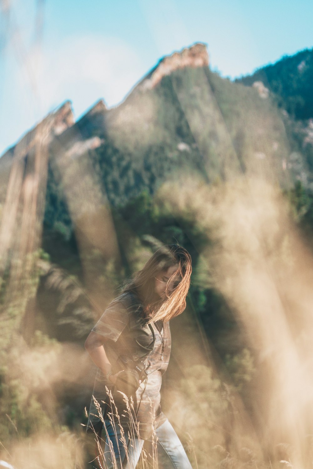 selective focus photography of woman wearing blue jeans