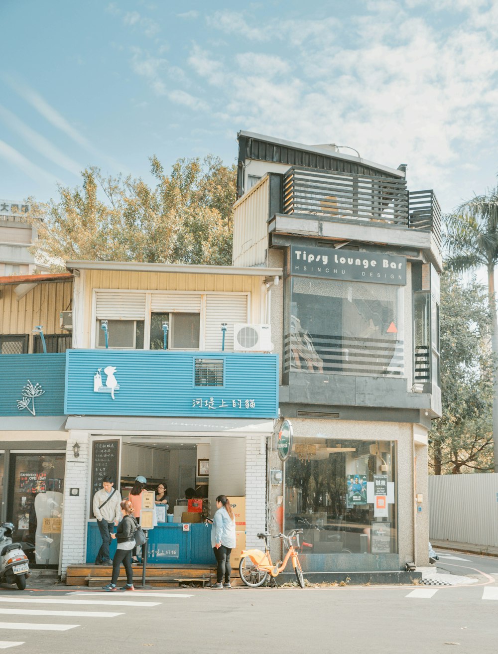 people standing near shop building