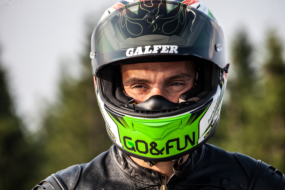 man wearing black multicolored helmet