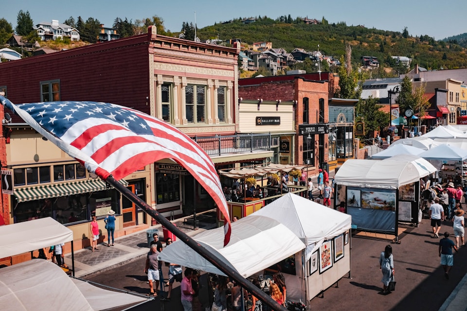 Downtown main street with the USA flag blowing in the wind