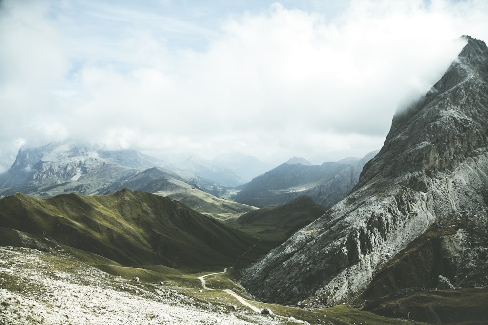 green mountain under white clouds