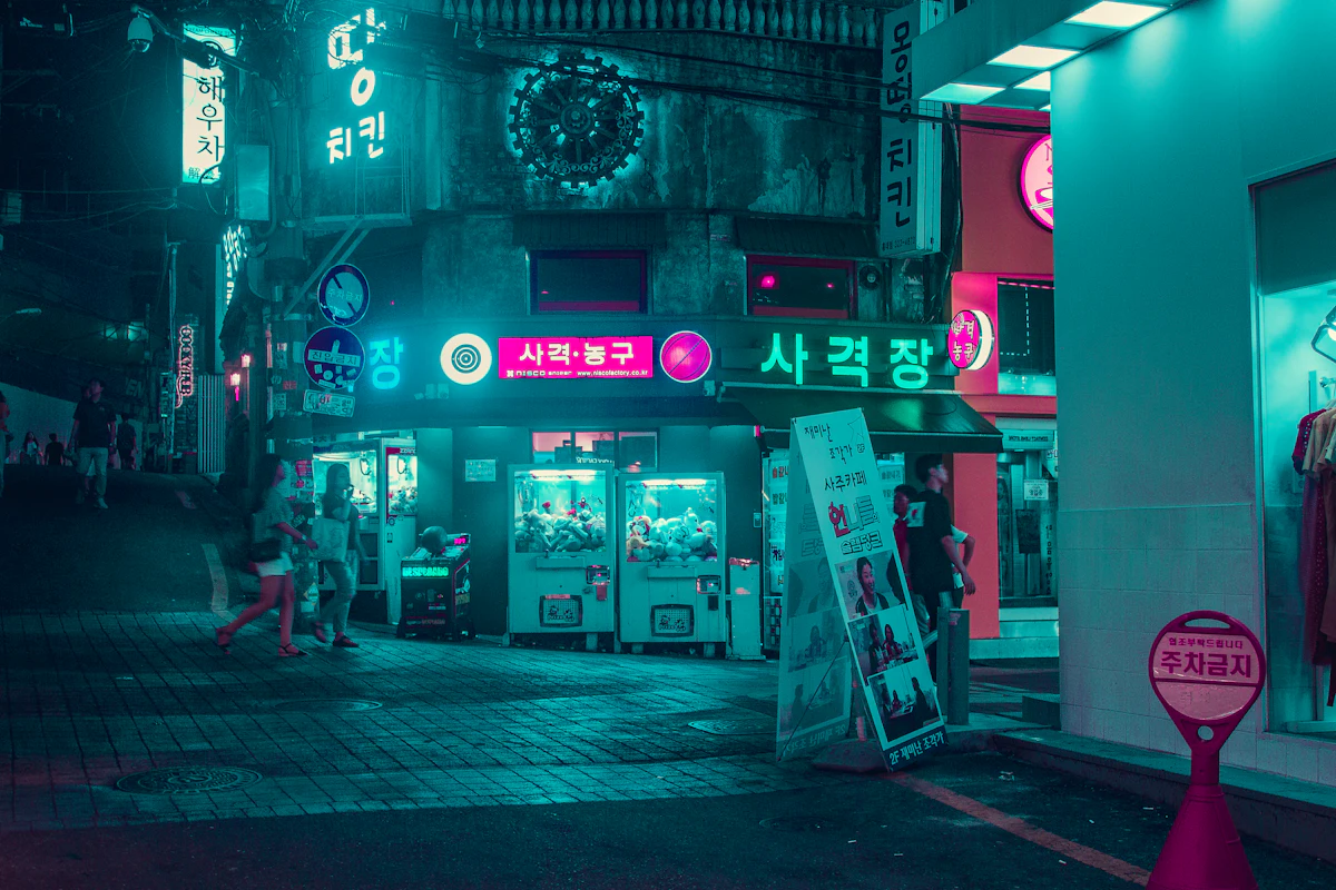 Neon-lit street of bars and arcades in Korea at night