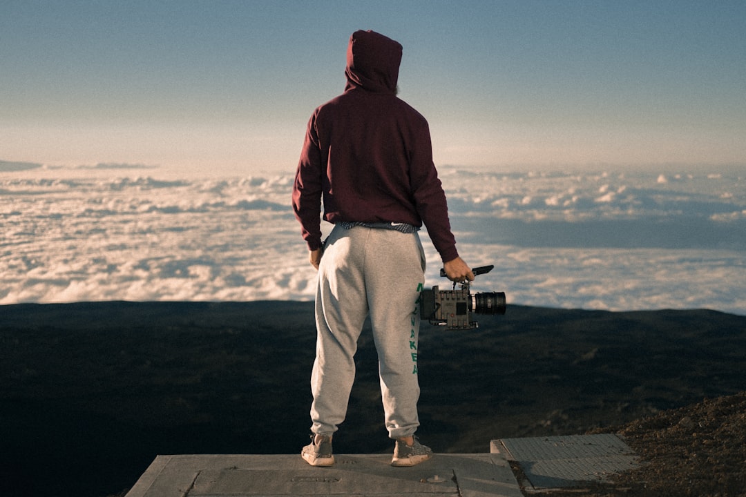 man holding video camera, Mauna Kea