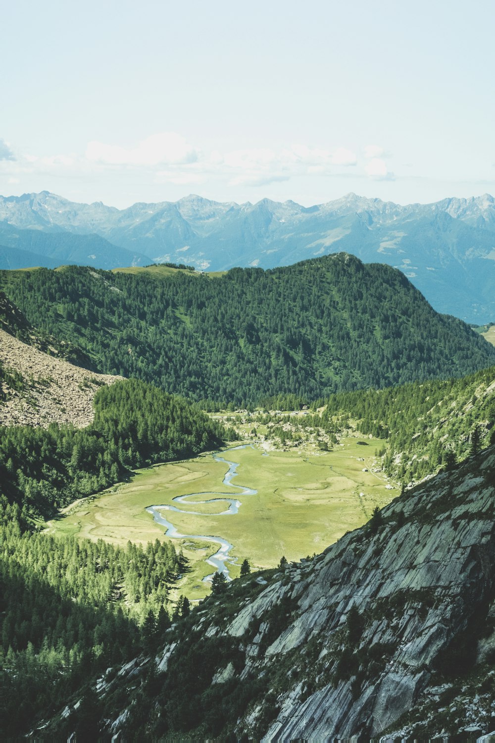 river between green grass field