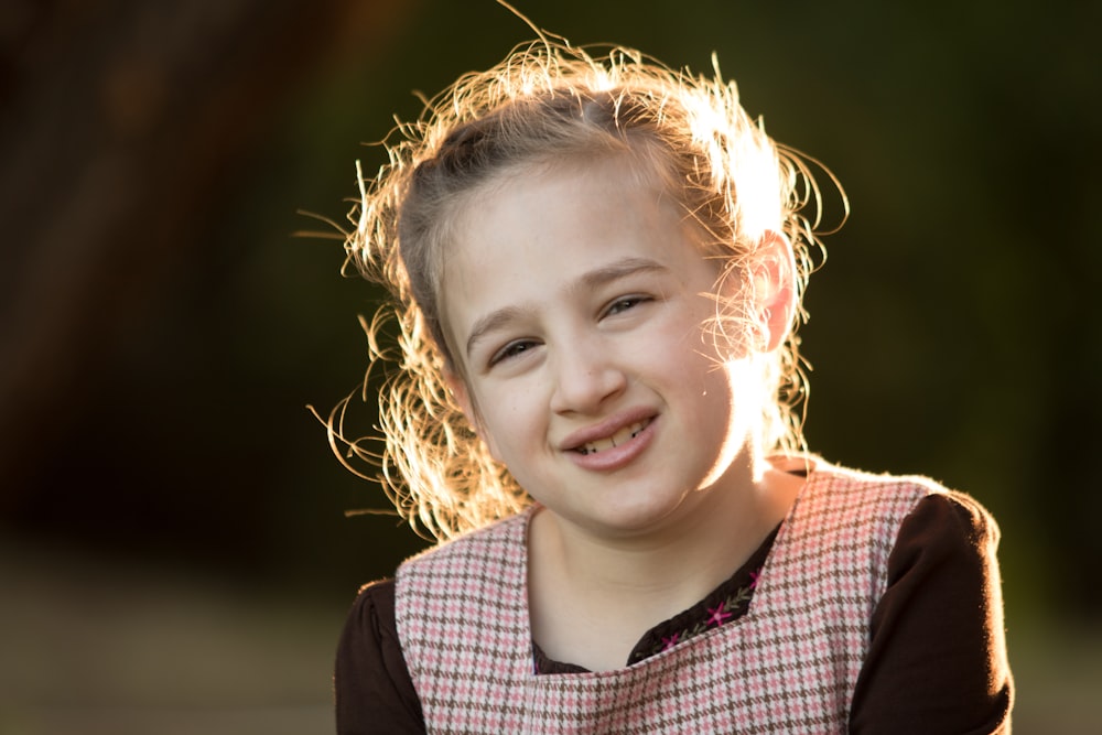 girl wearing brown and black long-sleeved shirt