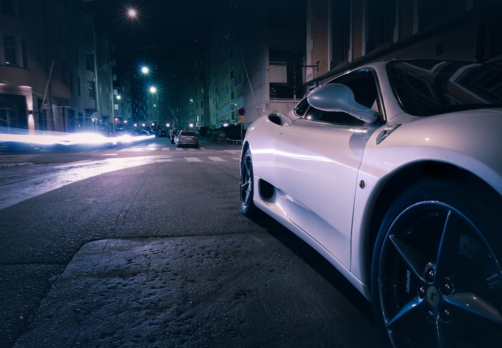 white car running during night time