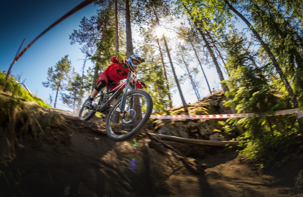 man using bicycle on trail