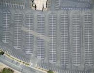 View of a large parking lot freshly paved and painted, ready for use.