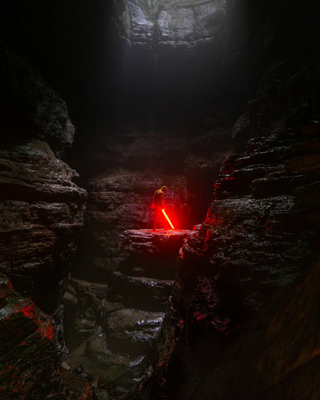After about a mile hike to the cave, we threw around 200 feet of rope down and started repelling, at the bottom we saw this cool spot and had an idea.  “Brennan, toss me the lightsaber…”