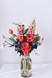 red flower arrangement on white table