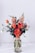 red flower arrangement on white table