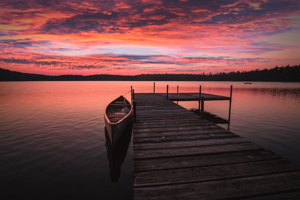 dock bridge beside canoe