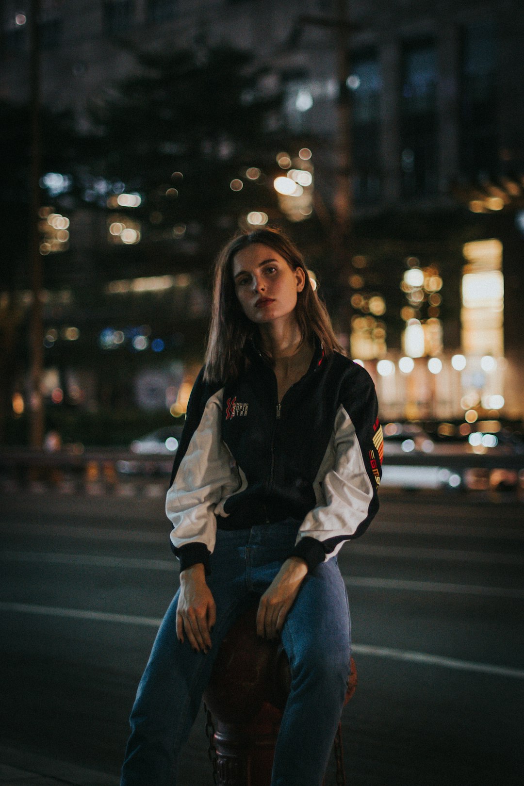 woman sitting on a fire hydrant