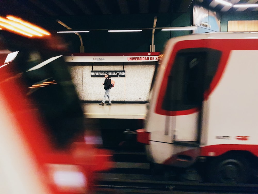 man walking near train