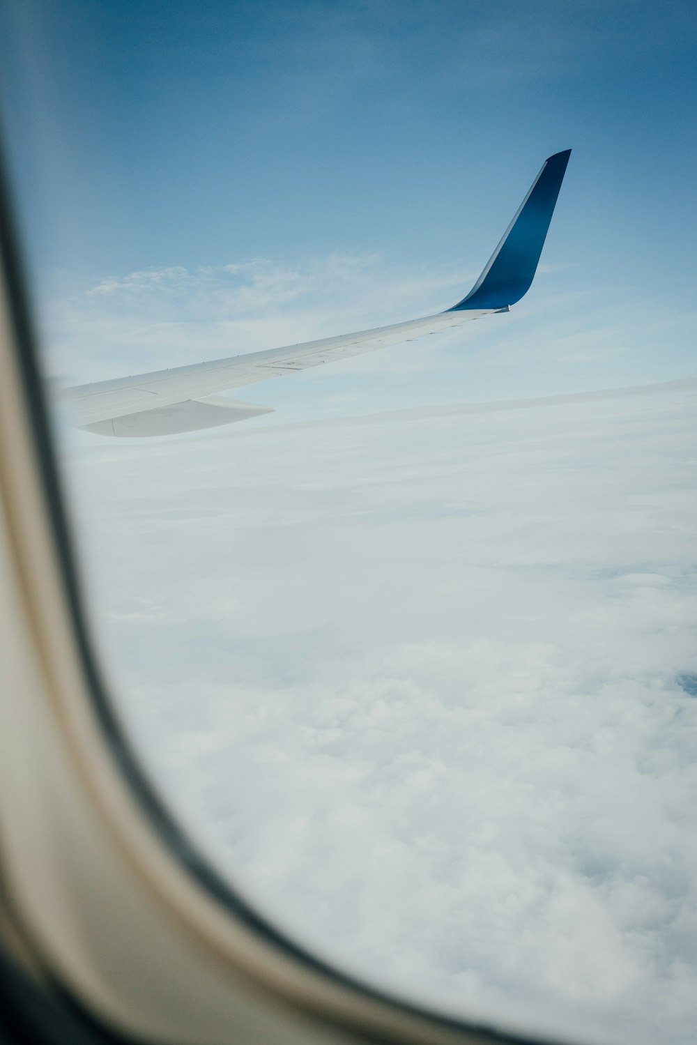 air plane on top of clouds