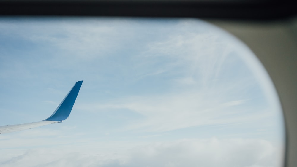 a view of the wing of an airplane through a window