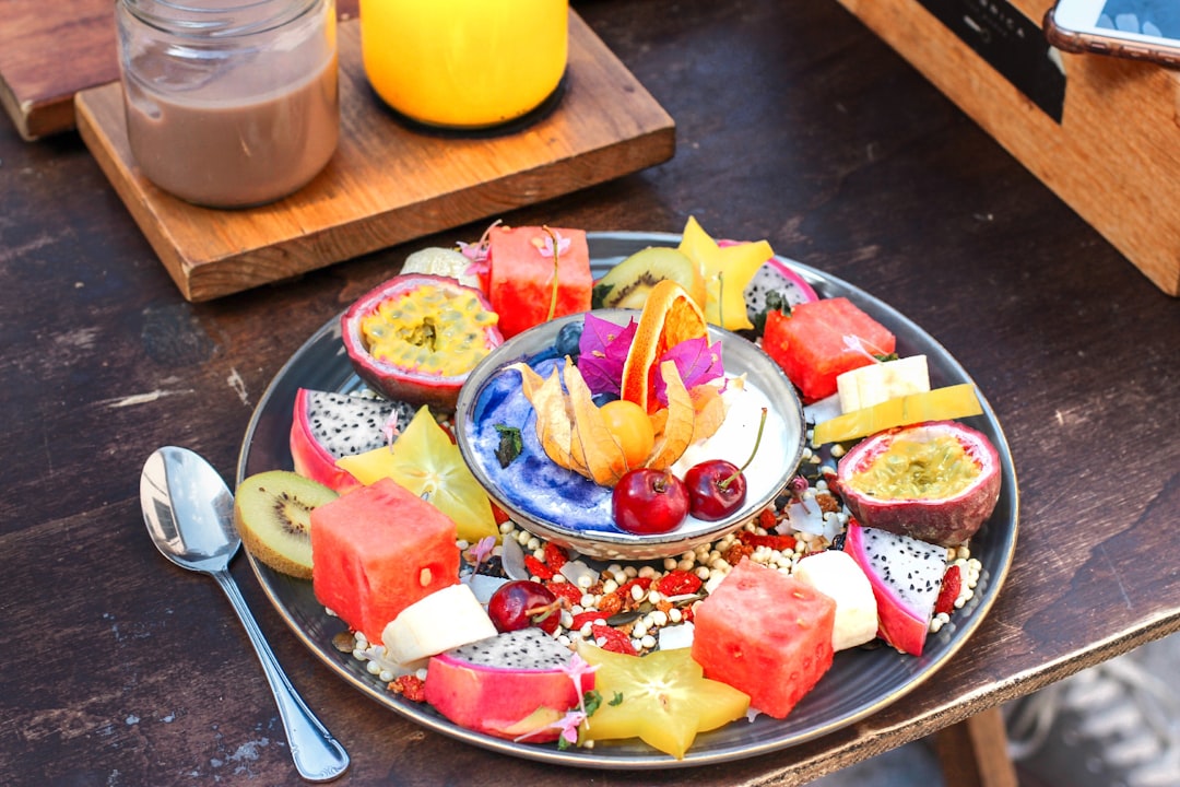 slice of fruits on plate with spoon, Spanish Breakfast