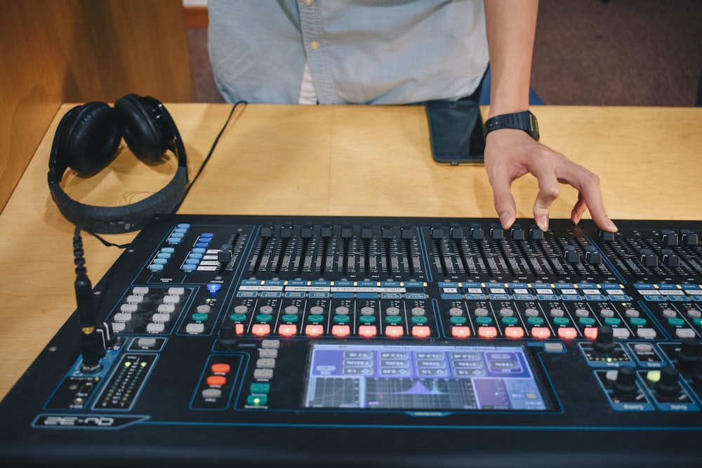 person using audio mixer