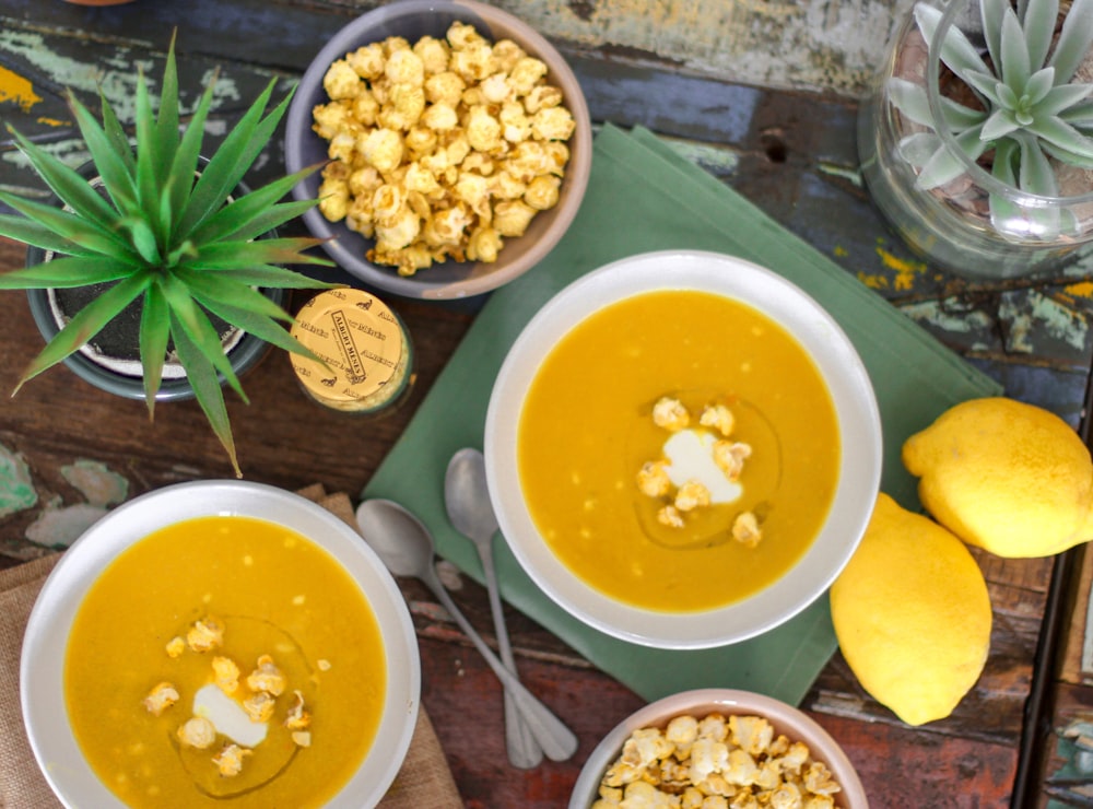 flat lay photography of popcorn on porridge with lemon fruits