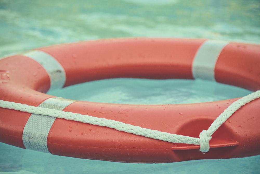 red and white lifebuoy