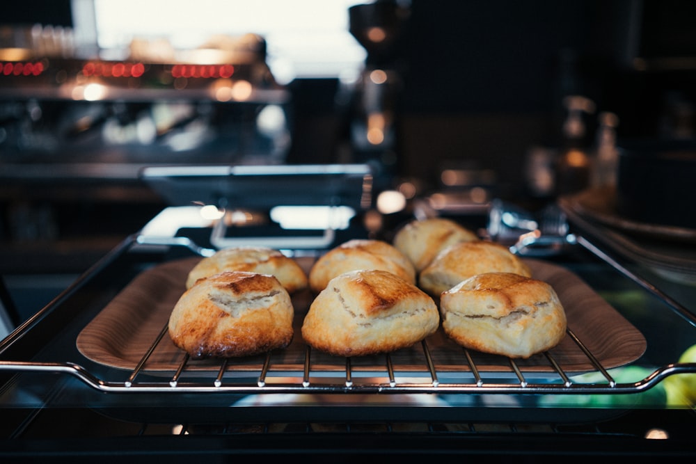 seven buns on gray steel grill