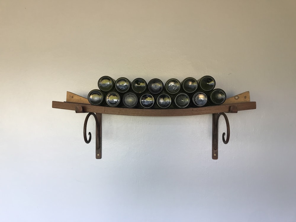 glass bottles on floating shelf