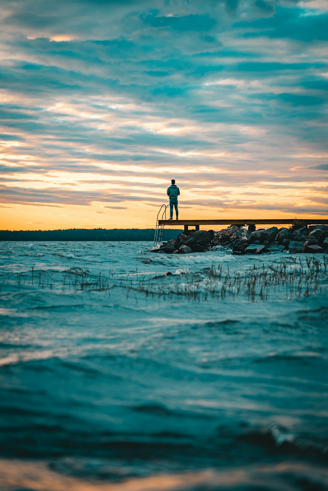 person standing on bridge