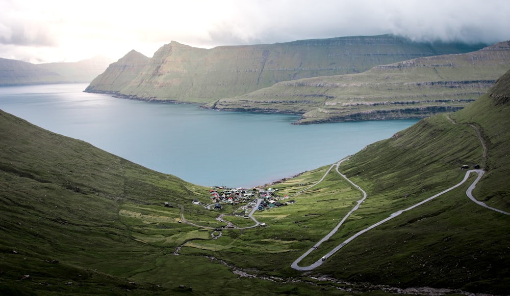 aerial photography of village near body of water