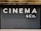 Large, bold white letters spell out 'CINEMA & CO.' on a black, corrugated metal shutter. The background appears industrial and slightly weathered, suggesting a closed or private cinema or entertainment venue.