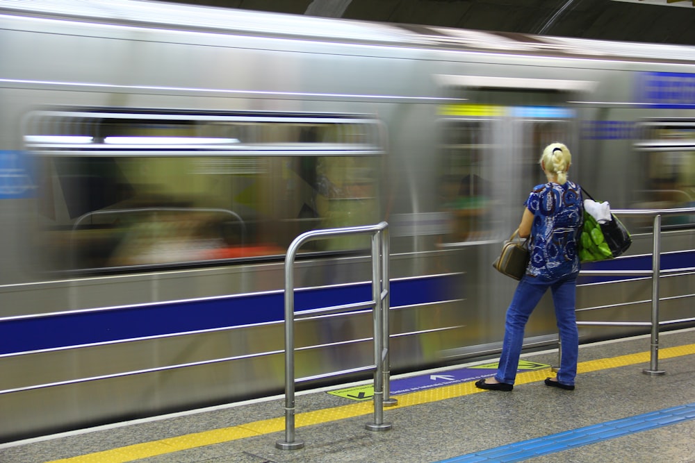 woman standing in front of train