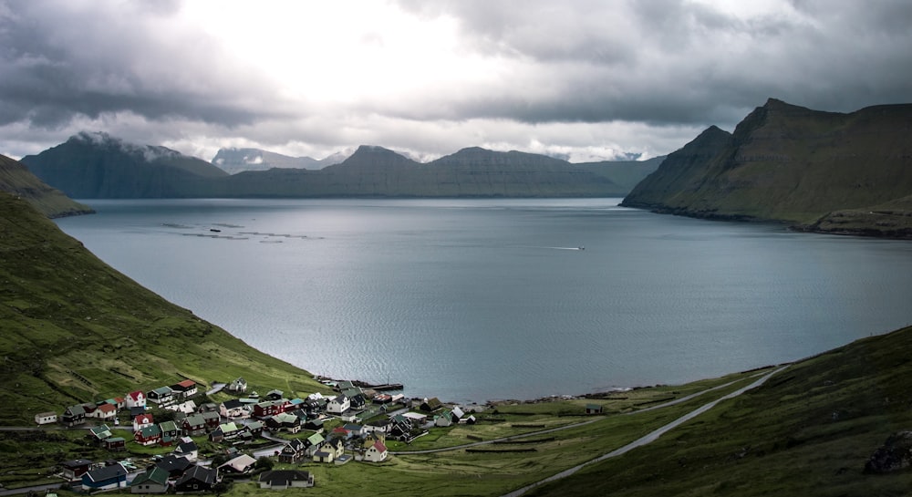 calm body of water and mountain