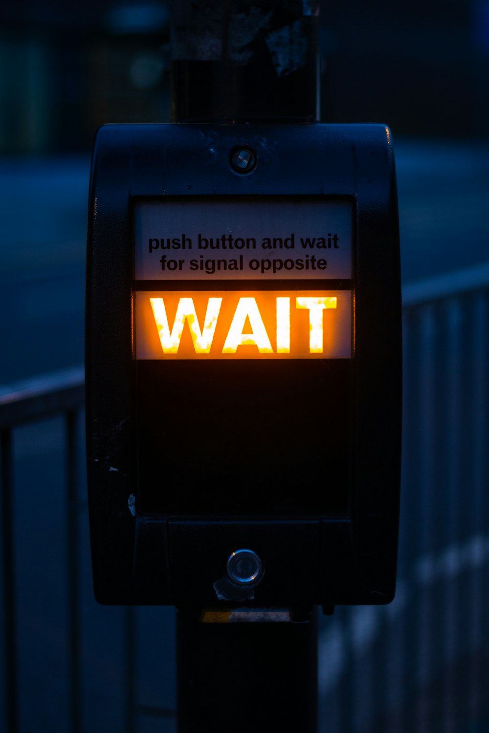 turned on black road signage displaying wait