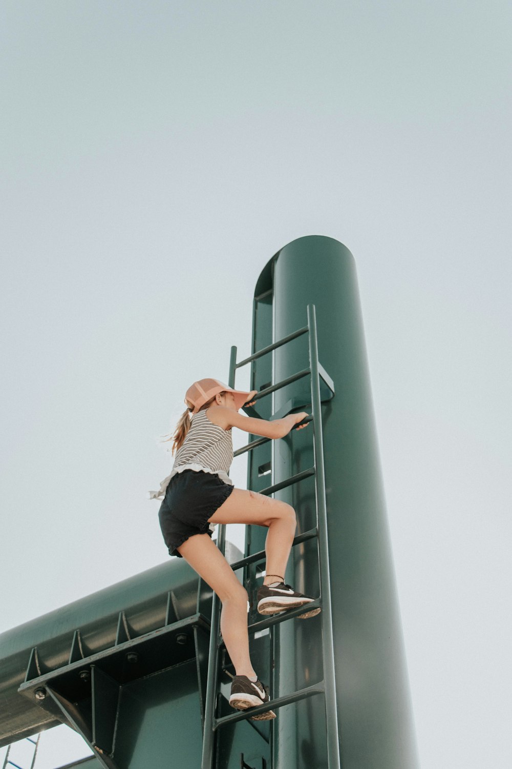 woman climbing ladder