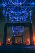 lighted gray metal bridge