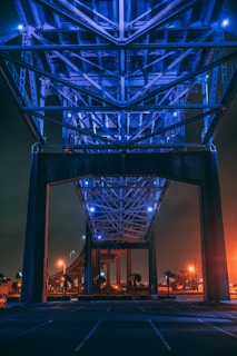 lighted gray metal bridge