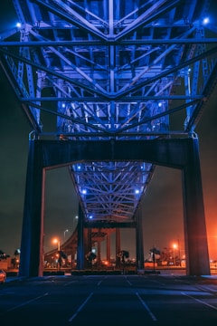 lighted gray metal bridge