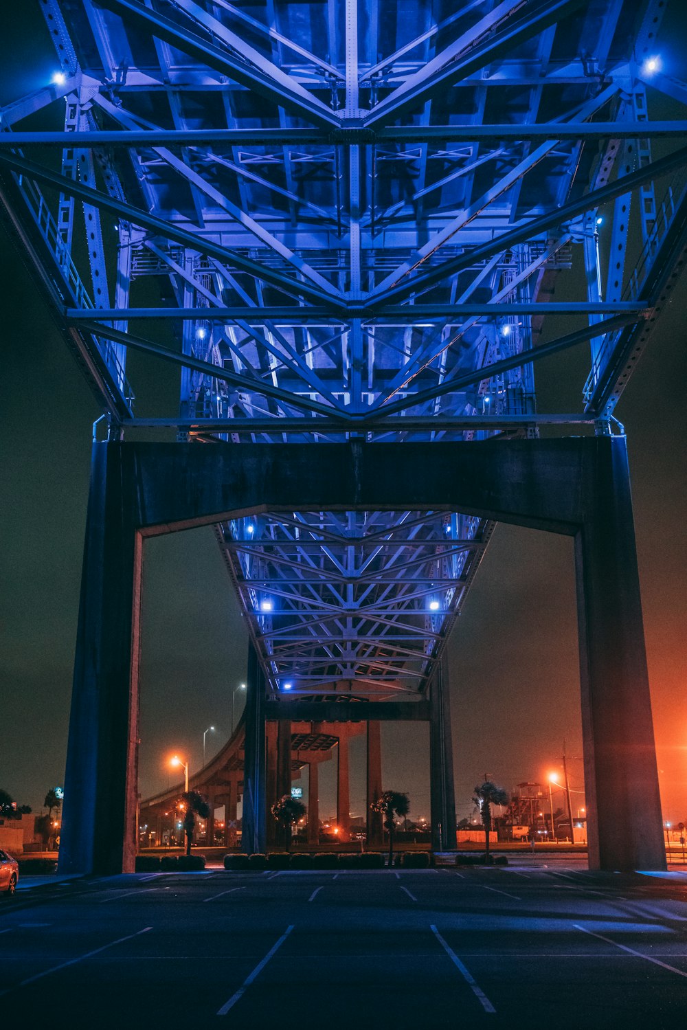 lighted gray metal bridge